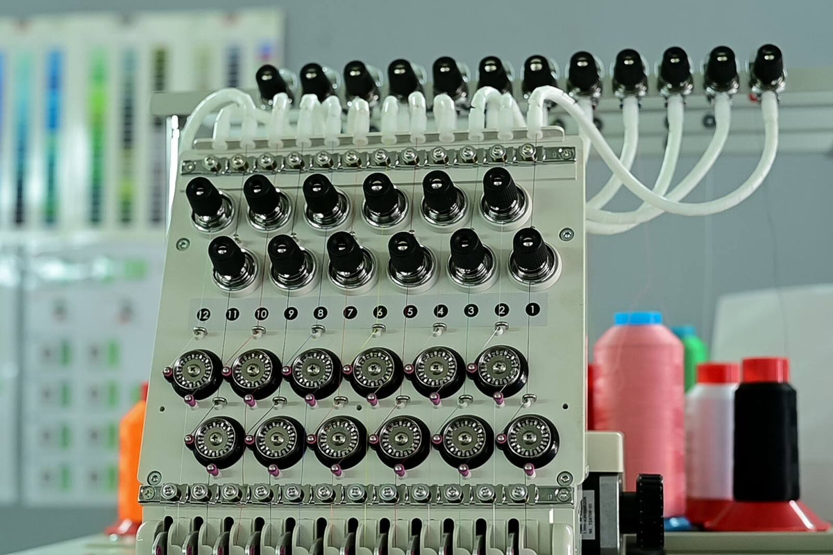 Close-up of the needle heads on a HomeLand multi-head embroidery machine