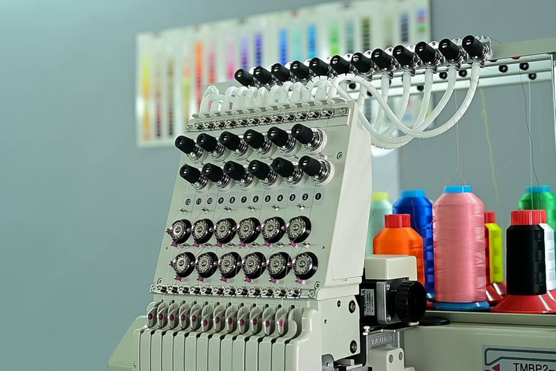 Multi-head embroidery machine with coloured thread cones at the HomeLand factory in Randburg