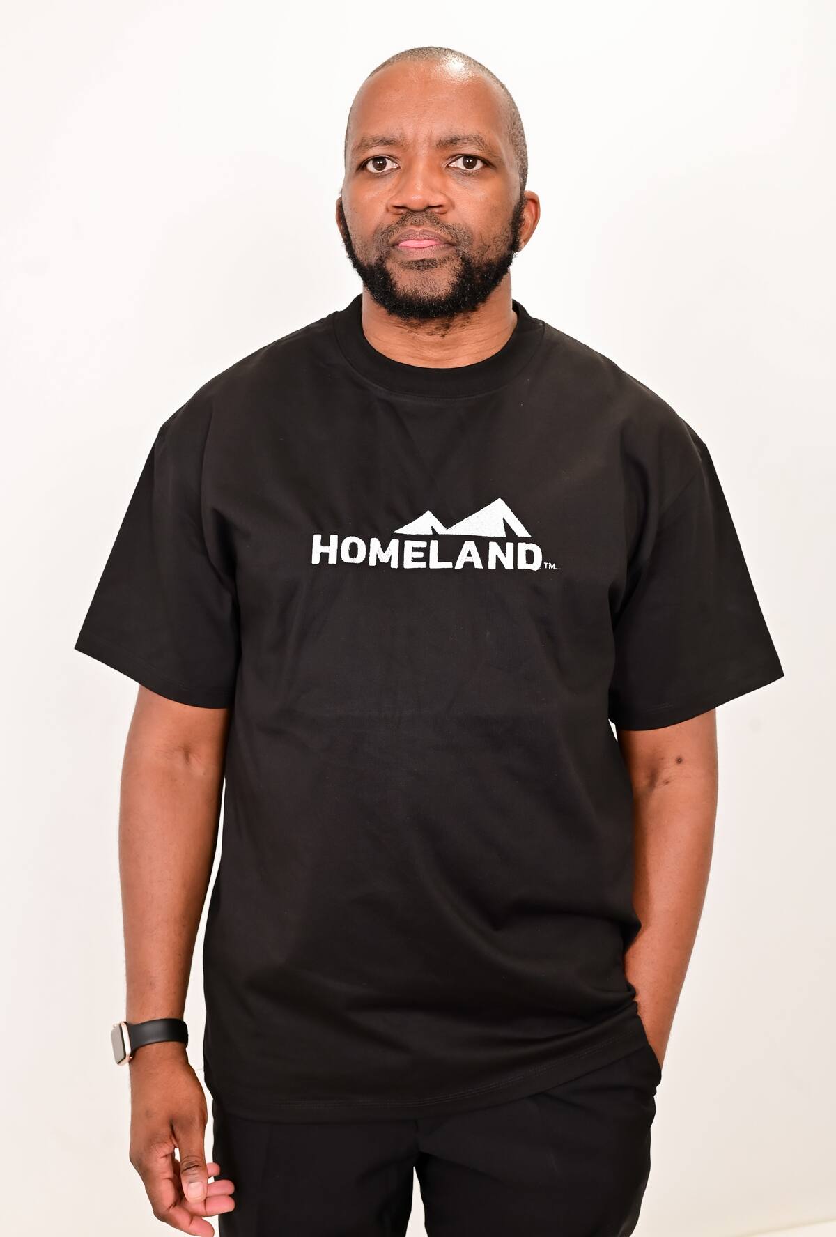 Man wearing a black HomeLand crew-neck T-shirt