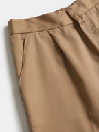 HomeLand School Long Pants in brown, close-up of the waistband, pleat and side pocket